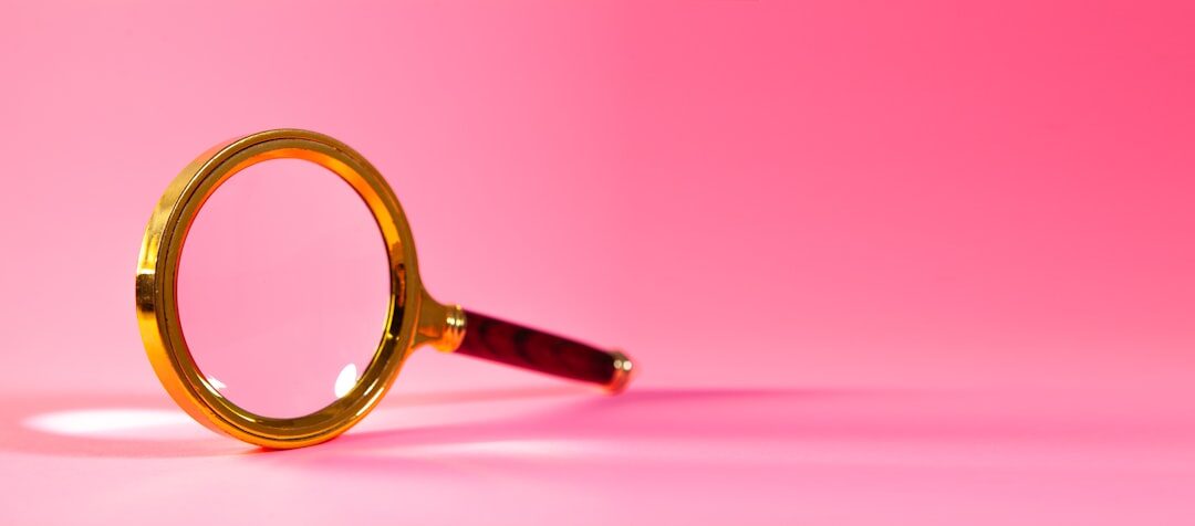 Magnifying glass over a printed financial contract highlighting fine print